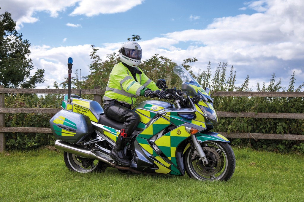 DC8G4J Stephen Cooper _First Responder, healthcare medical bike, ambulance transport of the West Midlands Ambulance Service NHS at Tutbury, Derbyshire, UK