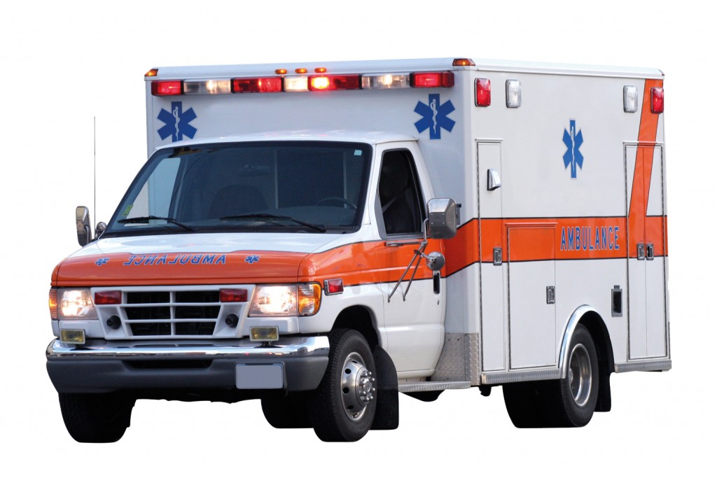 An ambulance with the emergency lights on.